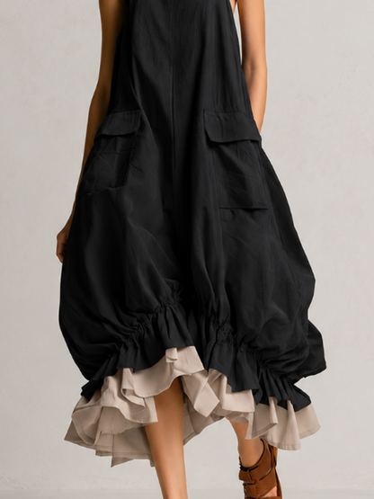 Vestido midi negro abullonado, sin mangas, con bolsillos grandes y dobladillo de volantes en capas